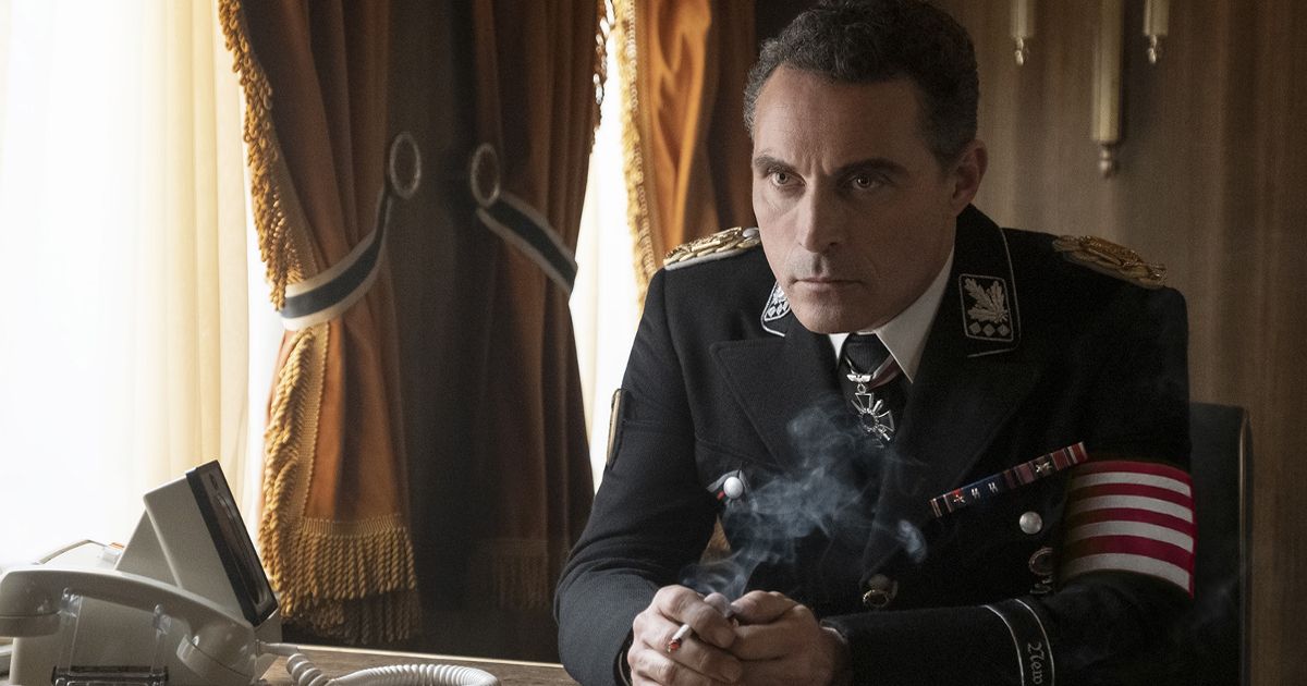 John smokes at his desk in The Man in the High Castle