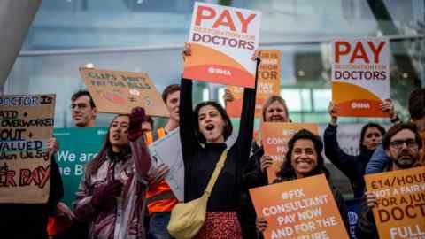 Consultants and junior doctors demand pay restoration on the picket line outside University College London on Wednesday